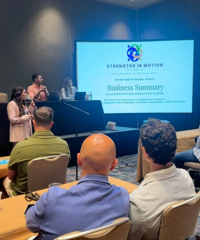 Joelle Ayoub presenting a Strengths in Motion business summary at a conference